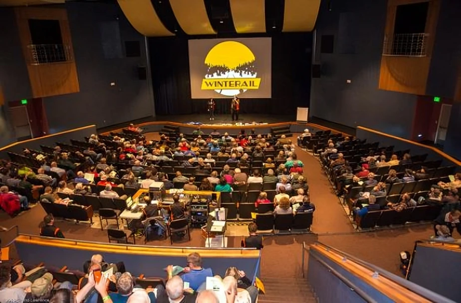 Audience attending an event in auditorium.