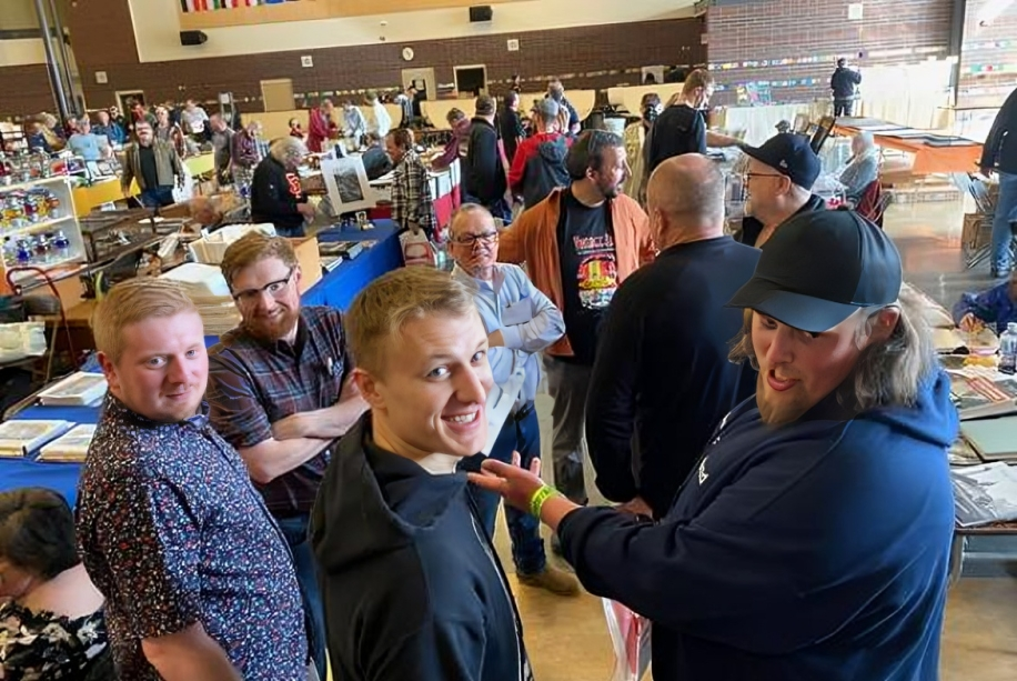 People socializing at a busy indoor event.