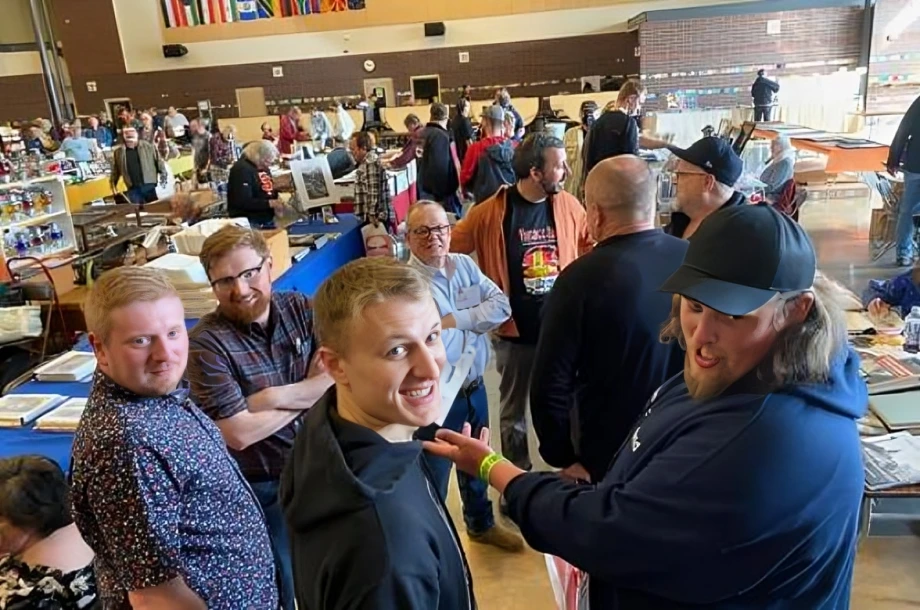 People socializing at a bustling indoor event.