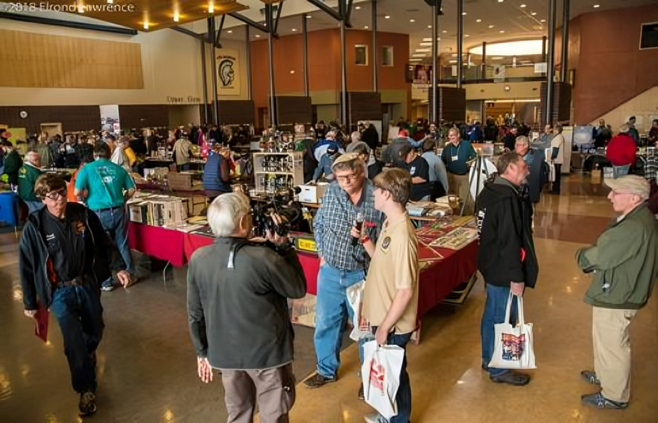 People attending a busy indoor event.